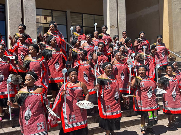 Members of the Judiciary in traditional Swazi dress on the steps of the court building